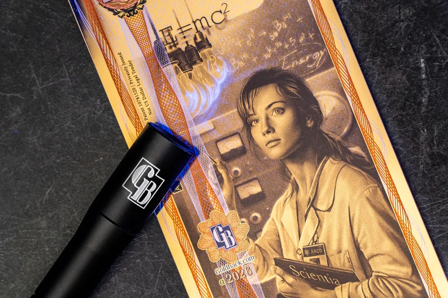 Close-up Idaho Goldbacks display used for the authenticity and security features guide